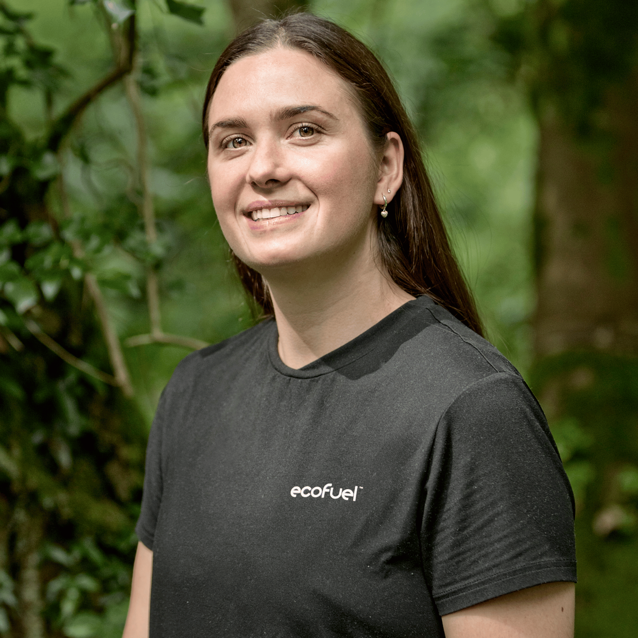 Woman wearing an 'ecofuel' t-shirt in a forest setting